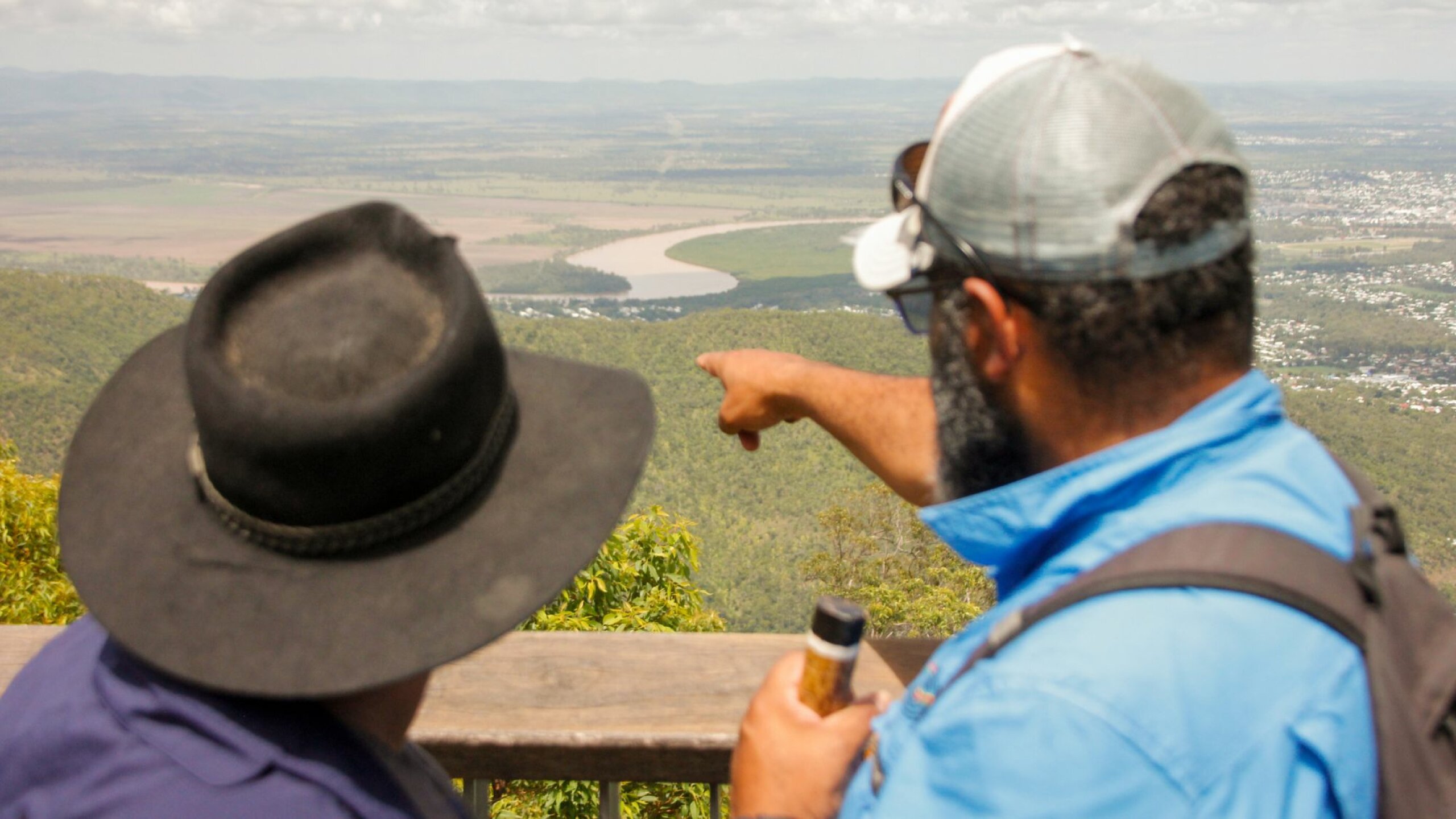 Two people overlooking the Darumbal Fitzroy