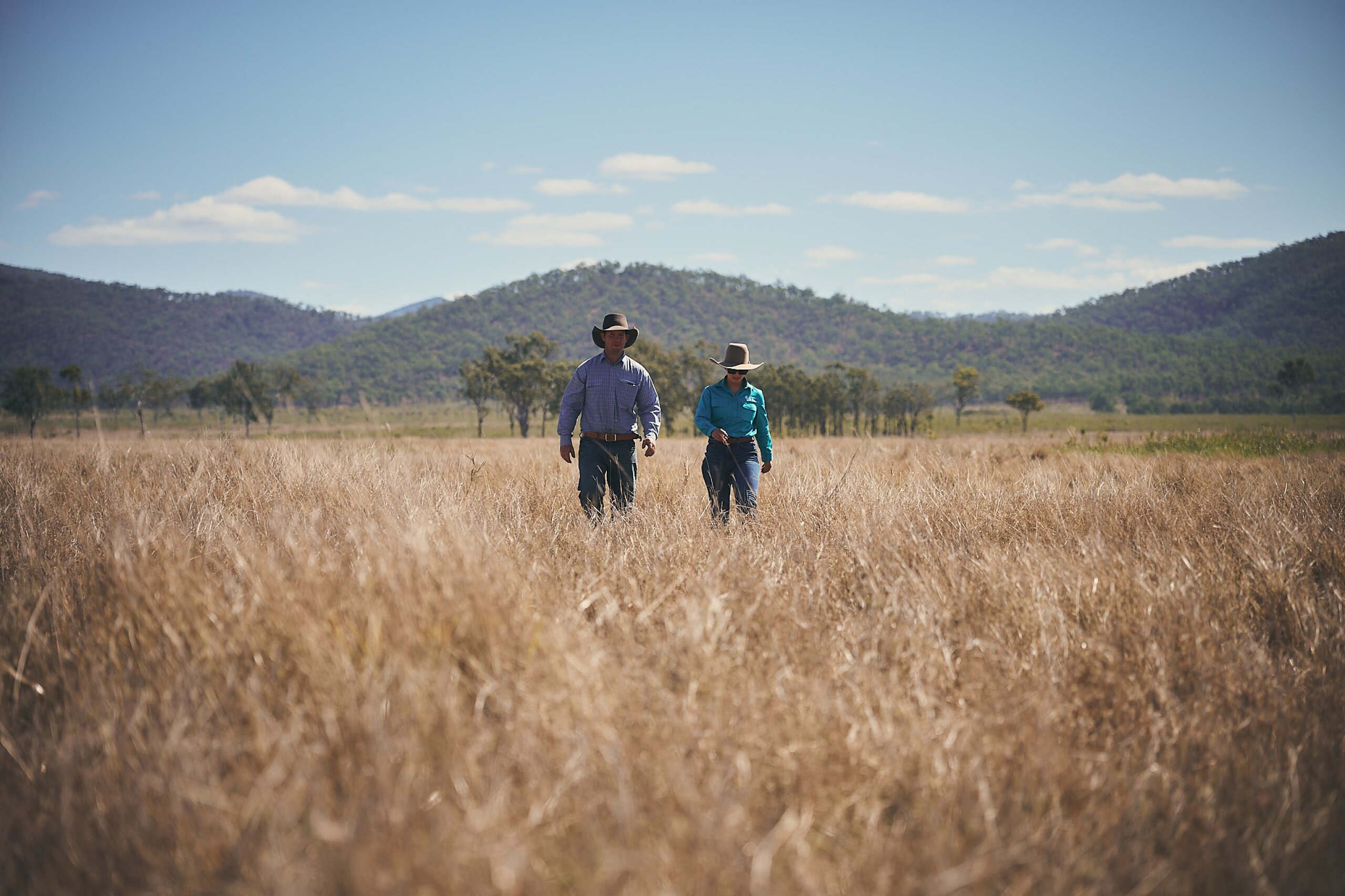 A land manager and an FBA staff member walk through a paddock.