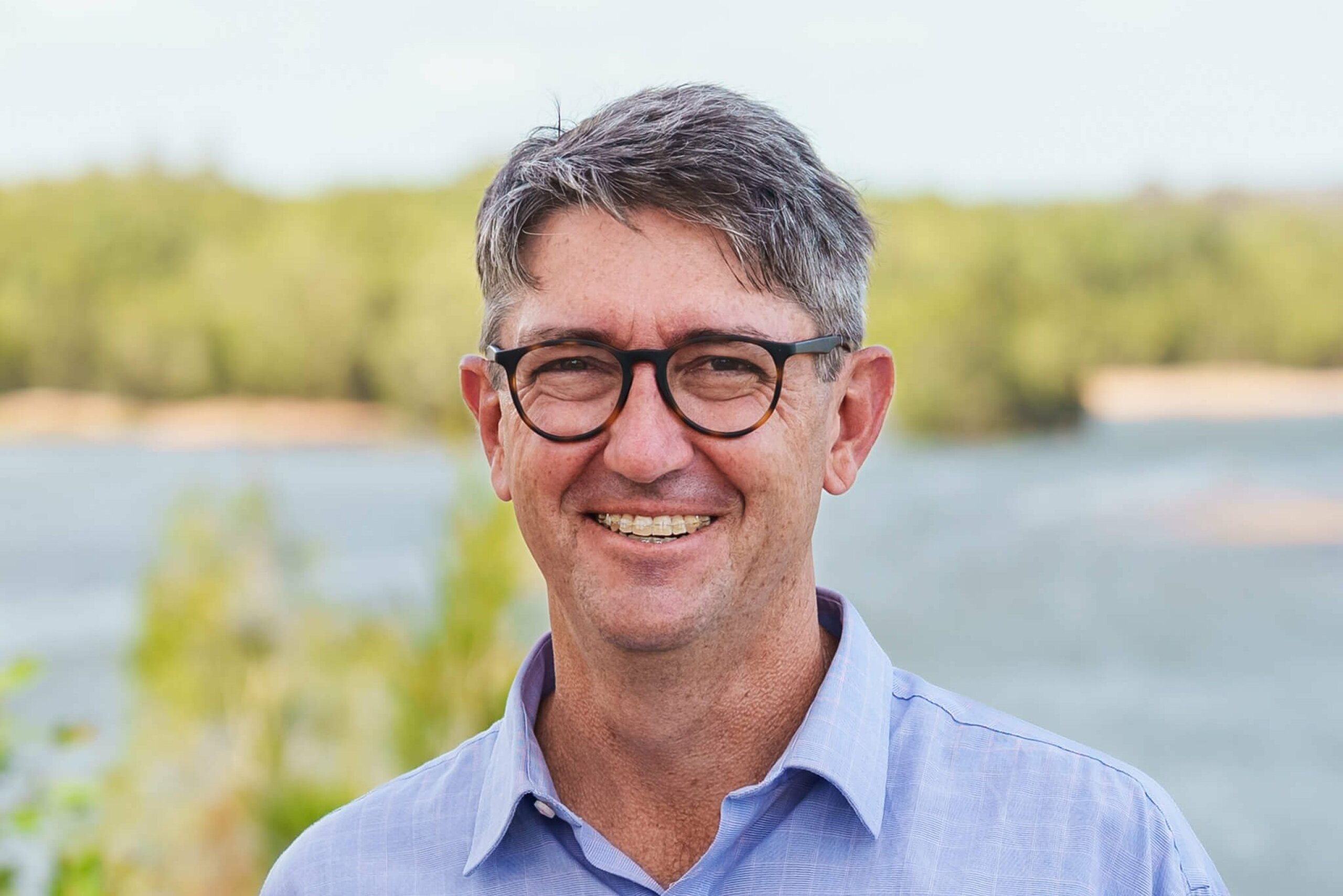 Michael Thomson smiles at the camera.